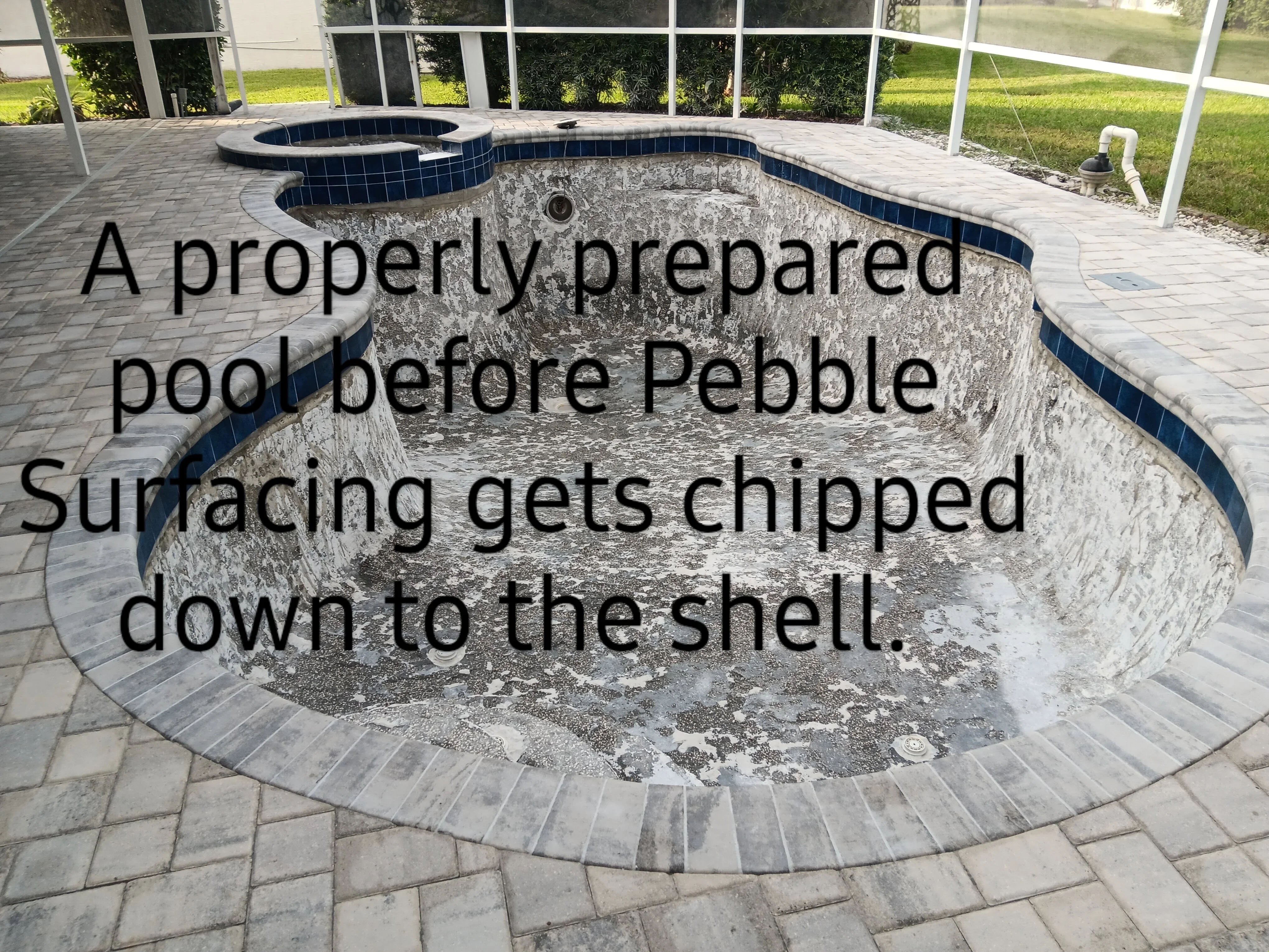 Empty concrete pool shell with bond beam coping, prepared for pebble surfacing application